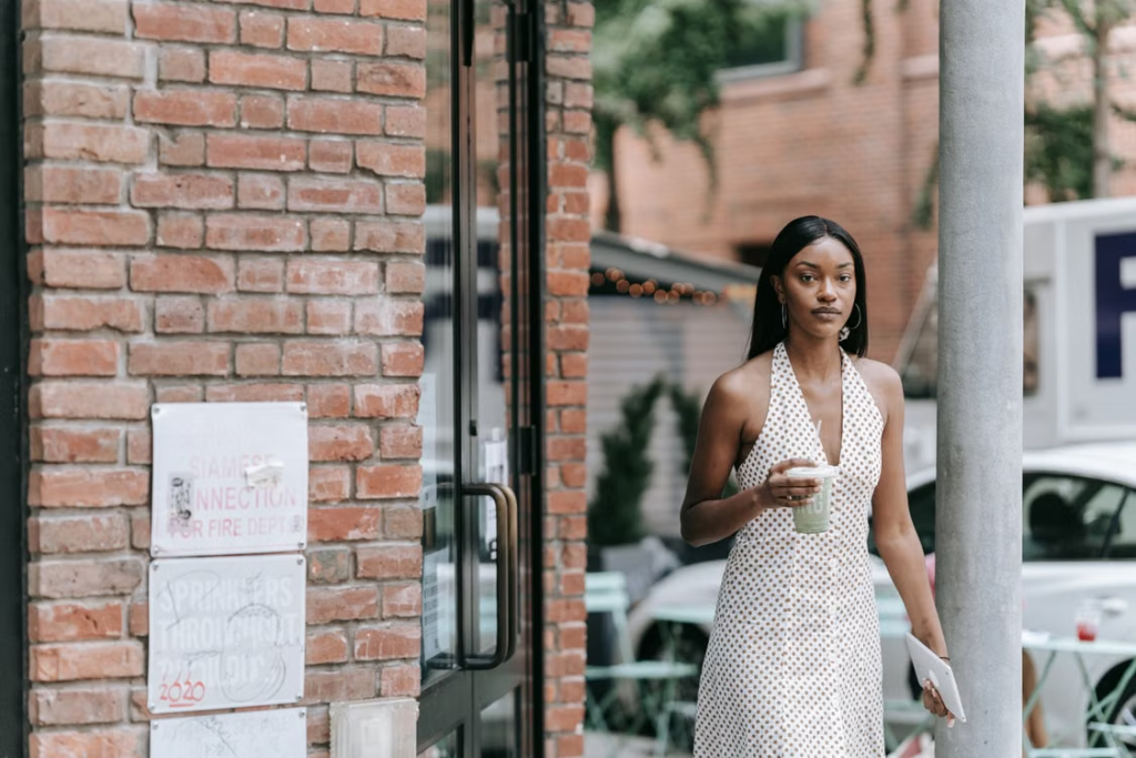 Going out capsule wardrobe pieces styled together including a corset top, midi dress and heels